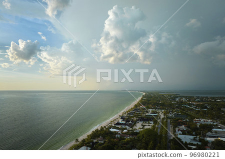 Aerial view of tropical storm over rich neighborhood with expensive vacation homes in Boca Grande, small town on Gasparilla Island in southwest Florida Aerial view of tropical storm over rich neighborhood with expensive vacation homes in Boca Grande, small town on Gasparilla Island in southwest Florida 96980221