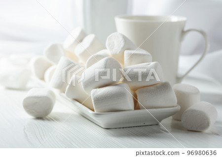 White marshmallows on a wooden table. 96980636