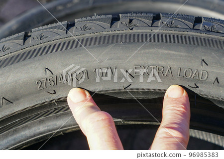 Side view of tire with tire width, height and wheel diameter designations, speed and load indices Side view of tire with tire width, height and wheel diameter designations, speed and load indices 96985383