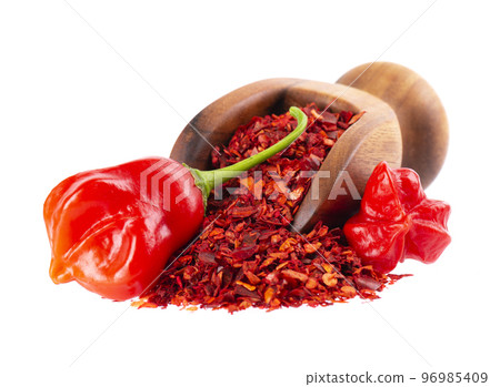 Fresh and dry ground red chili peppers isolated on white background. Capsicum baccatum or Bishop's crown pepper. 96985409