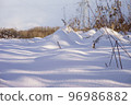 Snow on the field. The ground beneath the snow. Crystal white snow on the ground. 96986882