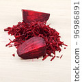 Grated beets. Grate beets on a grater. Grate the beetroot on the grater. 96986891