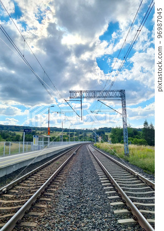 View of the modern railroad on a sunny summer day. Travel by train. View of the modern railroad on a sunny summer day. Travel by train. 96987045