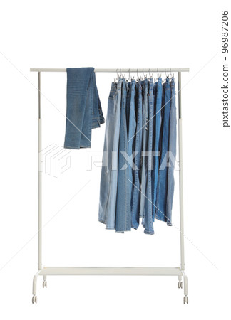 Rack with different jeans isolated on white Rack with different jeans isolated on white 96987206