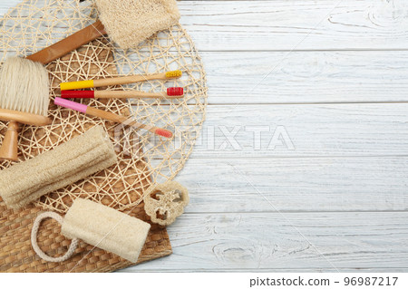 Flat lay composition with bamboo toothbrushes on white wooden table. Space for text Flat lay composition with bamboo toothbrushes on white wooden table. Space for text 96987217