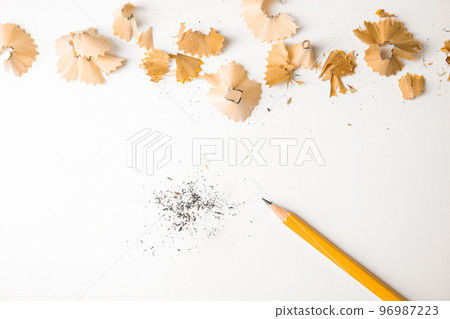 Pencil and shavings on white background, top view Pencil and shavings on white background, top view 96987223