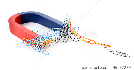 Magnet attracting paper clips on white background 96987279