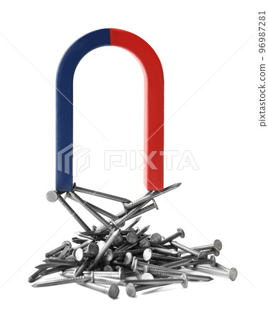 Horseshoe magnet attracting nails on white background Horseshoe magnet attracting nails on white background 96987281