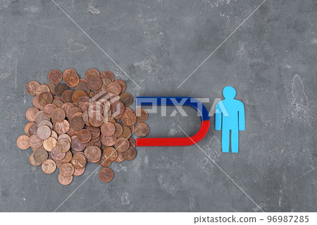 Paper person and magnet attracting coins on grey stone table, flat lay Paper person and magnet attracting coins on grey stone table, flat lay 96987285