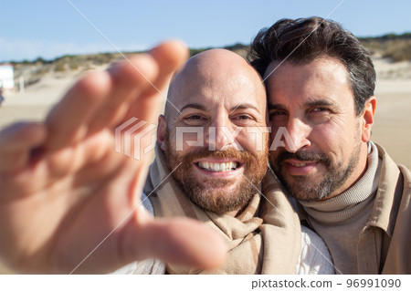 Selfie of positive gays on beach Selfie of positive gays on beach 96991090