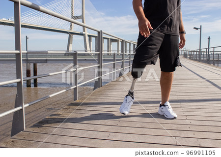 Close-up of man with mechanical leg on summer day Close-up of man with mechanical leg on summer day 96991105