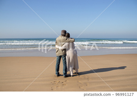 Senior couple enjoying beautiful seascape view Senior couple enjoying beautiful seascape view 96991127