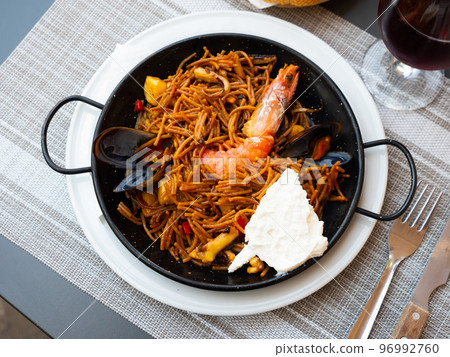 Paella with fideua, pasta noodles and seafood 96992760