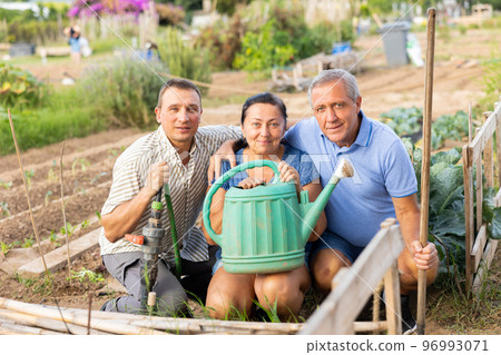Photo of cheerful family in garden 96993071