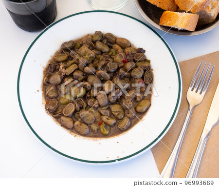 Habas la Catalana, tasty stew of beans in gravy with various sausages and bacon 96993689