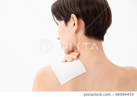 A woman applying a poultice 96994459