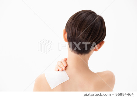 A woman applying a poultice 96994464