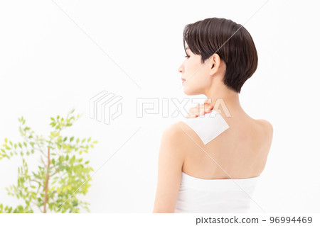 A woman applying a poultice A woman applying a poultice 96994469