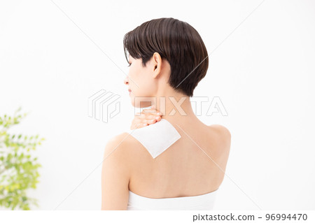 A woman applying a poultice A woman applying a poultice 96994470