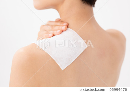 A woman applying a poultice 96994476