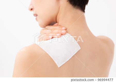 A woman applying a poultice 96994477