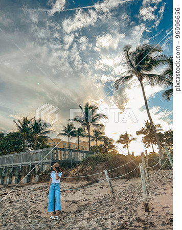 Young beautiful woman relax on the beach 96996656