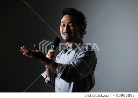 bearded man with microphone 96996892