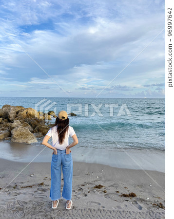 Young beautiful woman relax on the beach Young beautiful woman relax on the beach 96997642
