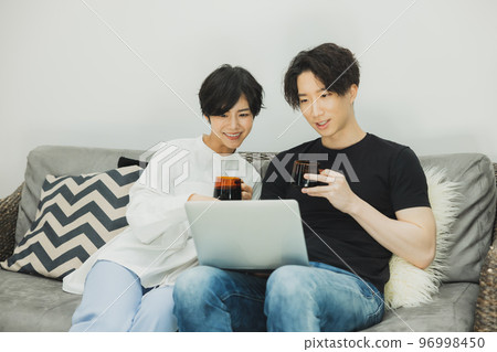 A couple to relax on the sofa 96998450