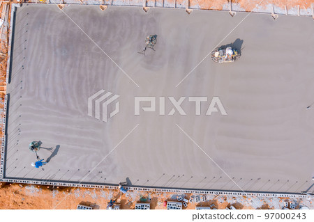 This process entails polishing and leveling cement screed mortar floors on construction site before they can be used 97000243