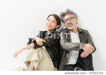 Portrait of a middle-aged couple in plain clothes Portrait of a middle-aged couple in plain clothes 97002542