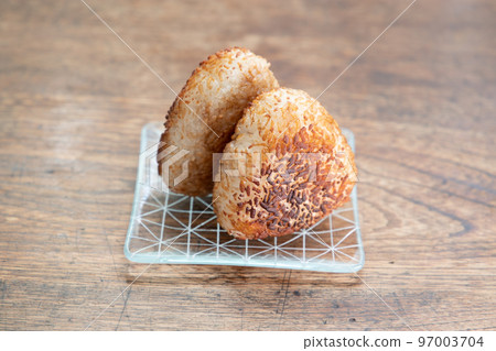 2 grilled rice balls with fragrant soy sauce 97003704