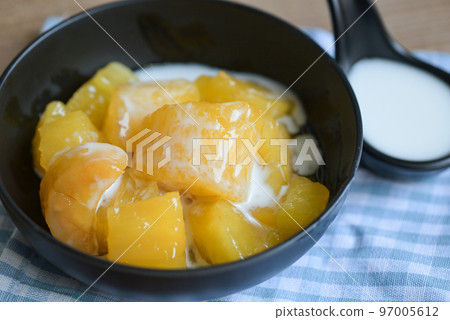 cassava food on the table food, sweet dessert made of boiled cassava, sugar and coconut milik - Thai food 97005612