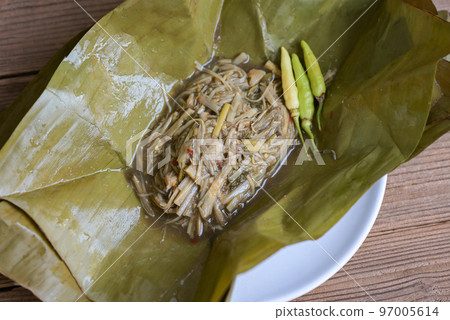 Bamboo shoots for food, Sliced and cooking bamboo shoots on banana leaf on the table food in Thailand Bamboo shoots for food, Sliced and cooking bamboo shoots on banana leaf on the table food in Thailand 97005614