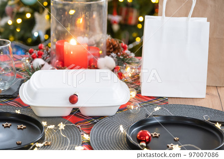 Food delivery service containers on table, festively served for the celebration of Christmas and new year. Tableware and loft-style decor. Saving time, hot order, disposable plastic box. mock up Food delivery service containers on table, festively served for the celebration of Christmas and new year. Tableware and loft-style decor. Saving time, hot order, disposable plastic box. mock up 97007086