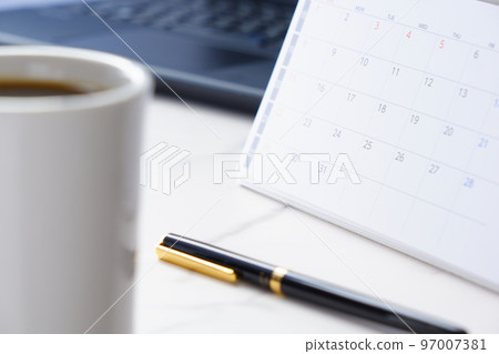 image of calendar and coffee mug 97007381