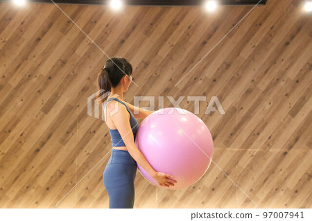 Balance ball and beauty yoga instructor at yoga studio Balance ball and beauty yoga instructor at yoga studio 97007941