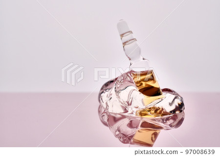 Ampoule of cosmetic product in a drop of gel. Ampoule of cosmetic product in a drop of gel. 97008639