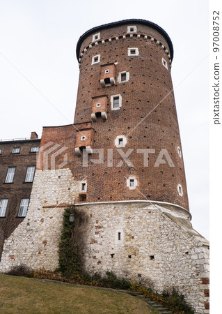 Royal Wawel royal castle in Krakow in rainy early spring weather in Poland. historic castle in the old city Gardens and cathedra, Cracow, Poland. Travel attraction Royal Wawel royal castle in Krakow in rainy early spring weather in Poland. historic castle in the old city Gardens and cathedra, Cracow, Poland. Travel attraction 97008752