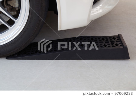 A composition of putting tires on a ladder rail used when inspecting the underside of a vehicle with low ground clearance. A composition of putting tires on a ladder rail used when inspecting the underside of a vehicle with low ground clearance. 97009258