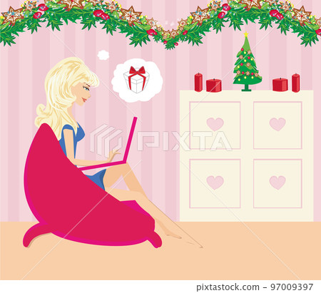 christmas online shopping - beautiful girl relaxing at home 97009397
