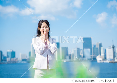 Young business woman rejoicing outside Young business woman rejoicing outside 97010001