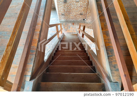 Beautiful wooden staircase in an old building or castle. Beautiful wooden staircase in an old building or castle. 97012190