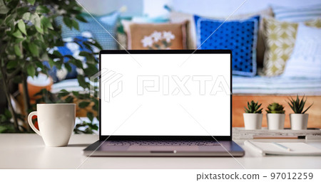 Blank screen laptop on desk 97012259