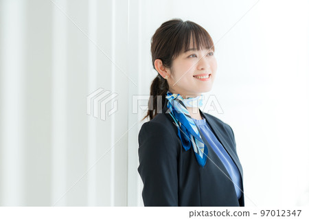 A young woman wearing a scarf A young woman wearing a scarf 97012347