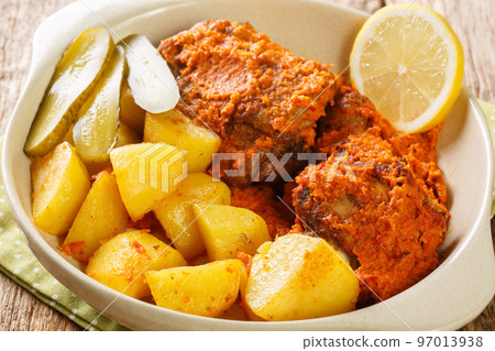 Macanese African Chicken Galinha a Africana close up on the pot. Horizontal 97013938