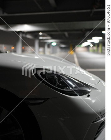 Porsche 718 Boxster standing in the parking lot at night 97014651