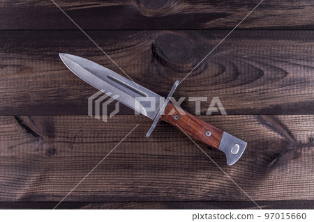 ak44 bayonet knife on wooden table 97015660