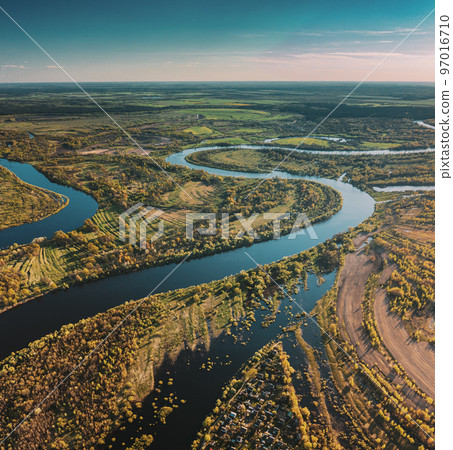 Village Near River, Aerial View Green Forest Woods And River Landscape In Sunny Spring Summer Day. Top View Of Nature, Bird's Eye View. Trees Standing In Water During Spring Flood floodwaters. woods 97016710