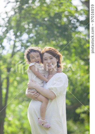 A pregnant mom and her 2-year-old daughter 97016859